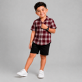 Maroon check shirt with black shorts